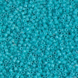 Close-up of small turquoise beads scattered densely.