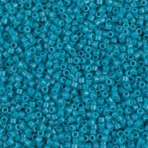 Close-up of small turquoise beads scattered densely.