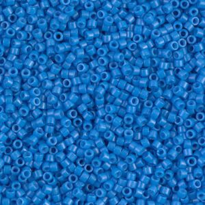 Close-up of small blue seed beads scattered densely.