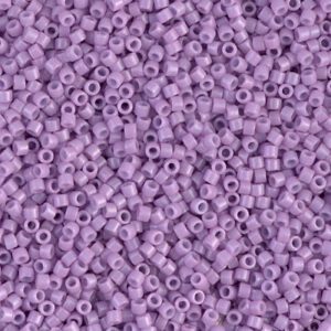 A close-up of numerous small purple beads scattered together.