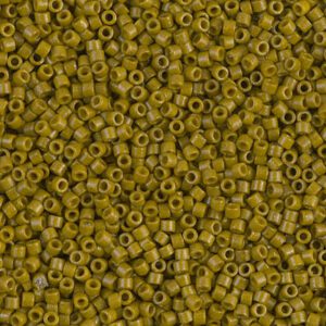 Close-up of numerous small, olive-green cylindrical beads.