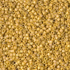 Close-up of numerous small, yellow cylindrical beads.