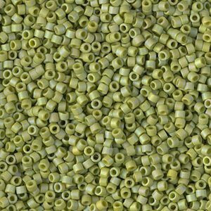 Close-up of small green cylindrical beads with central holes.