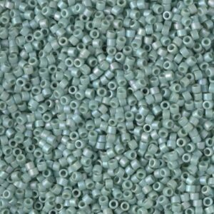 Close-up of small, light blue seed beads.