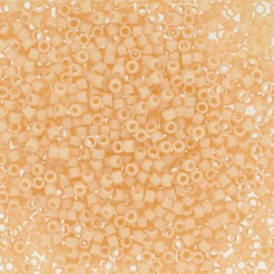 Close-up of a surface covered with small, round beige beads.
