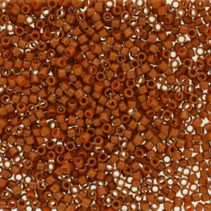 Close-up of numerous small brown beads with silver linings.