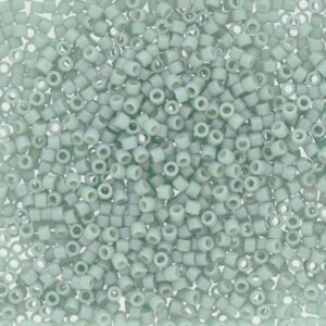 Close-up of small translucent light blue beads.