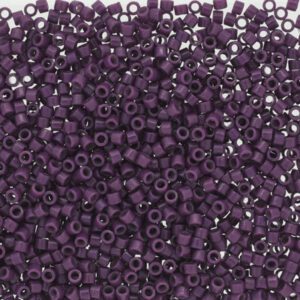 Close-up of numerous small purple beads densely packed together.