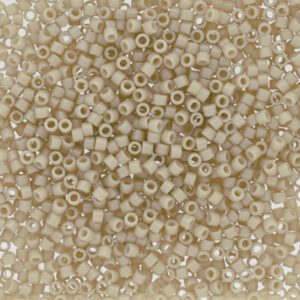 Close-up of small, translucent beige beads with a shiny finish.