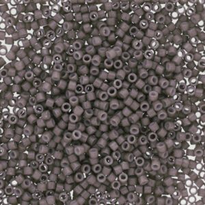 Close-up of small gray seed beads with a matte finish.