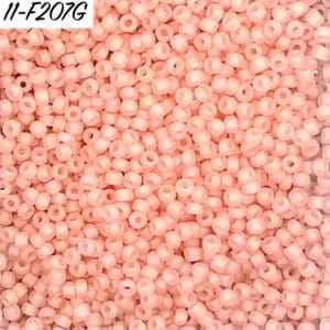 Matte light peach seed beads close view