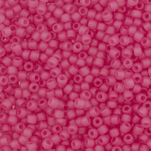 Close-up of small, round pink beads with central holes.