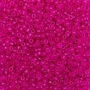 Fuchsia glass seed beads close view