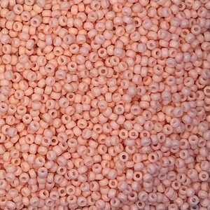 Close-up of small pink seed beads scattered densely.