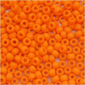 A close-up of numerous small orange beads.
