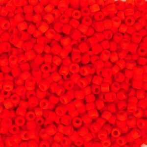 Close-up of small red plastic beads scattered uniformly.