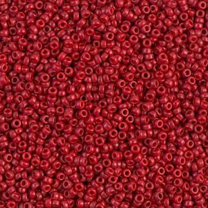 A close-up of numerous small red beads densely packed.