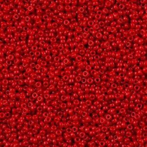A close-up of numerous small red beads densely packed together.