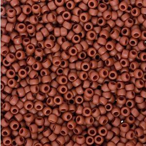 Close-up of numerous small brown beads with holes.
