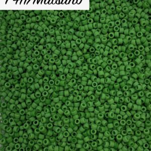 Close-up of tiny green beads scattered densely.