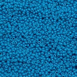 A close-up of numerous small blue beads.