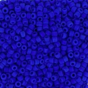 Close-up of numerous small, blue cylindrical beads.