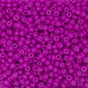 Close-up of numerous small, shiny purple beads.