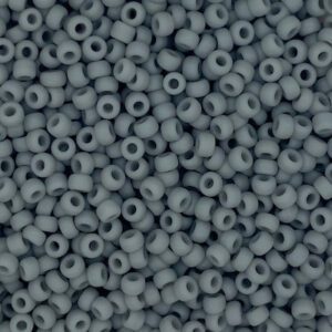 Close-up of small, matte gray beads scattered densely.