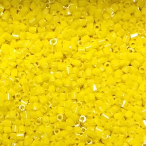 Yellow plastic beads scattered closely together.