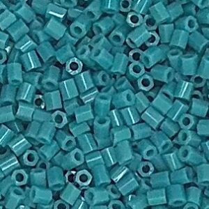 Small turquoise cylindrical beads close-up.