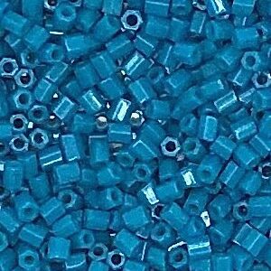 Blue hexagonal beads closely packed together.