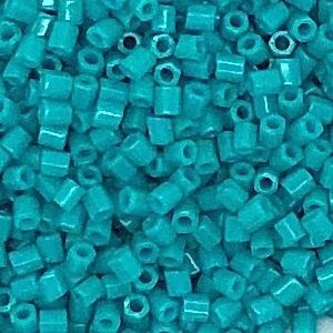 Turquoise cylindrical beads scattered in pile.