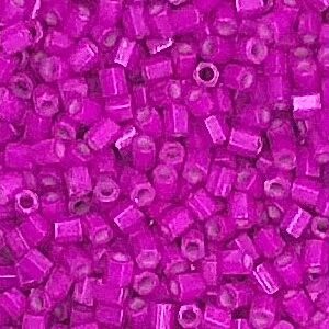 Bright pink plastic beads in close-up view.