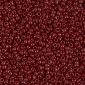 Close-up of numerous small maroon beads.