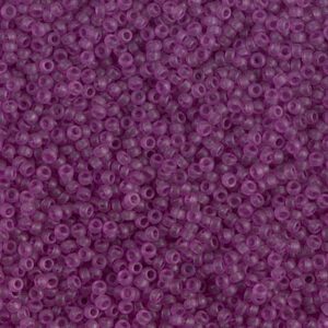 Purple seed beads in a scattered pattern.