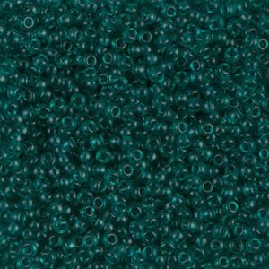 Teal glass seed beads, densely packed together.
