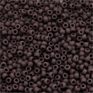 Brown seed beads scattered in a pile.